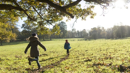 Children running on the estate at Scotney Castle